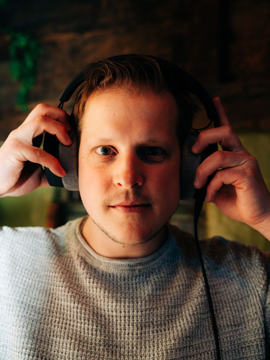 Sas Cras with headphones, portrait