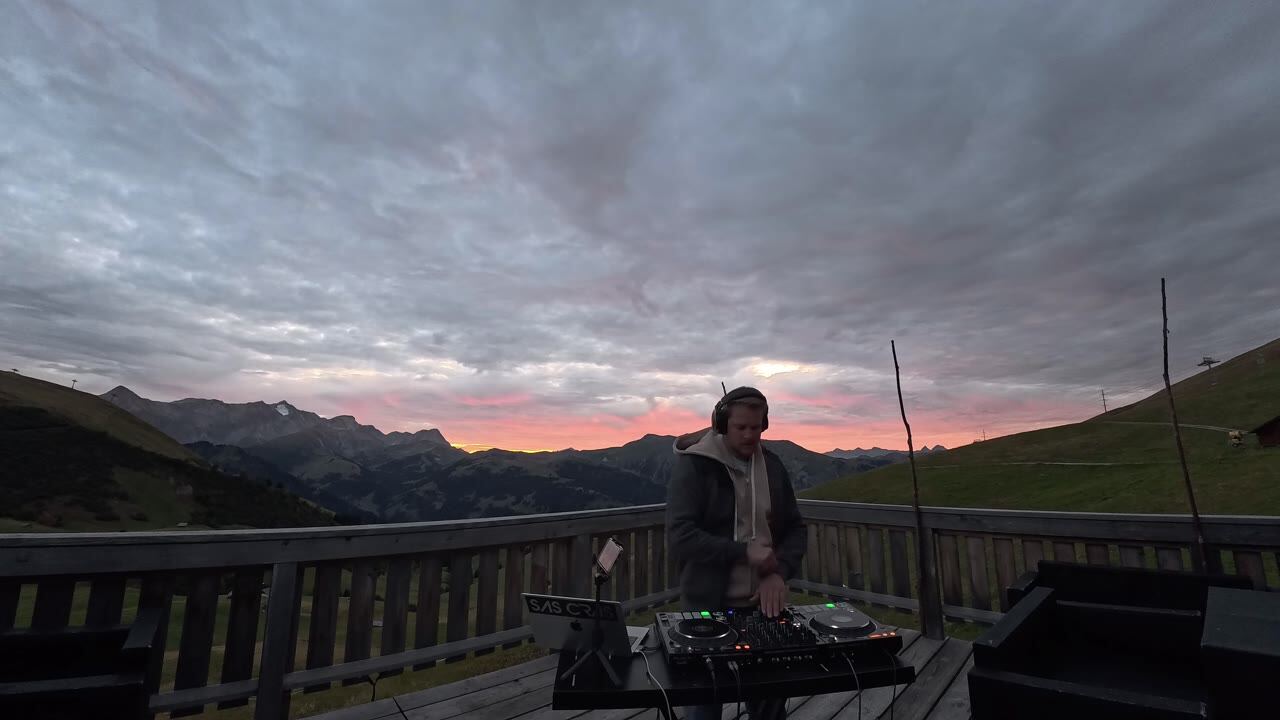 Sas Cras at the decks on a mountain terrace at dusk